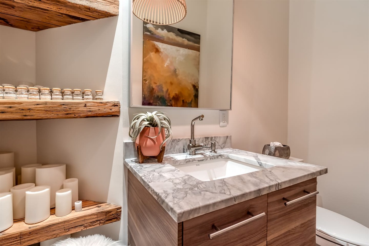 First floor half bathroom located outside living room