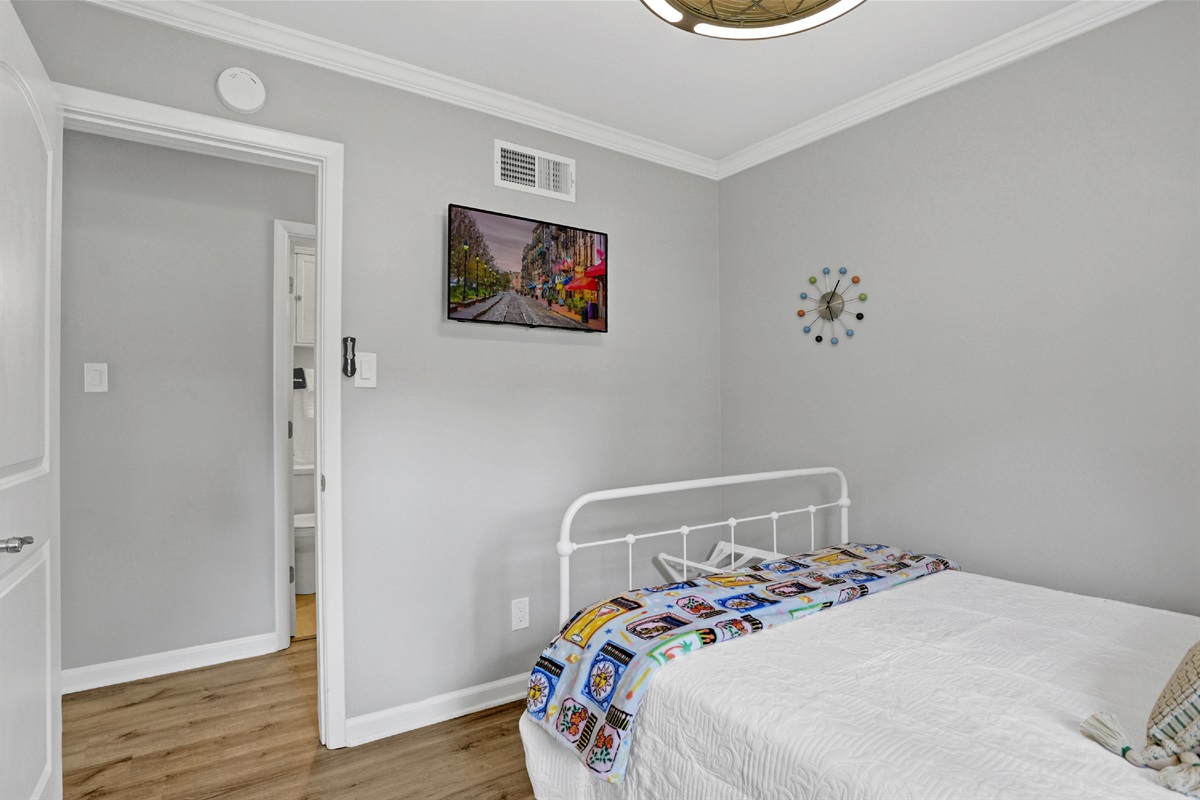 Wind down with your favorite shows—smart TV perfectly positioned for bed-viewing comfort.