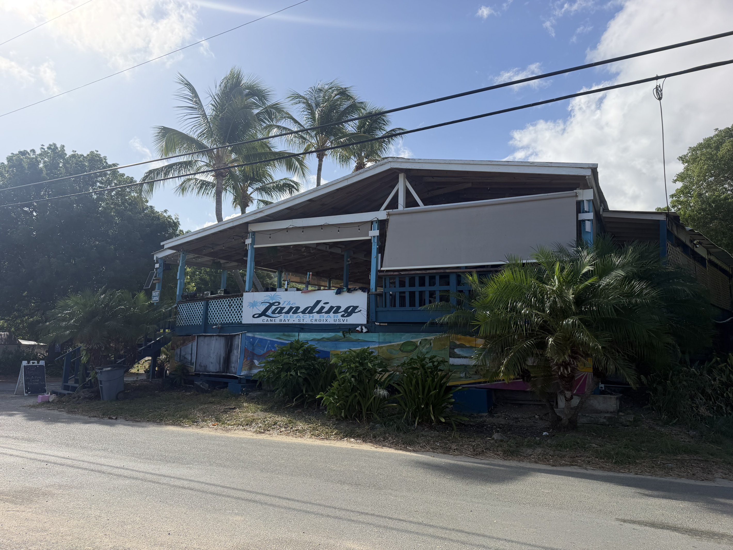 Located in Cane Bay, The Landing Beach Bar has island cocktails, local beer on tap, a fresh and diverse menu from American bar food to fresh seafood to vegetarian options! Family friendly. Incredible view!