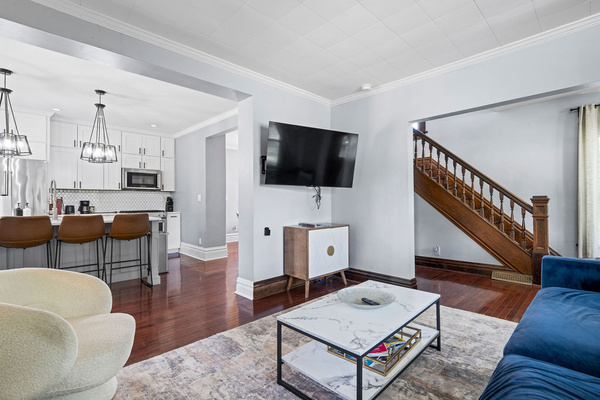 An open and bright main floor layout that seamlessly connects the living space, kitchen, and stairs—perfect for keeping everyone connected.