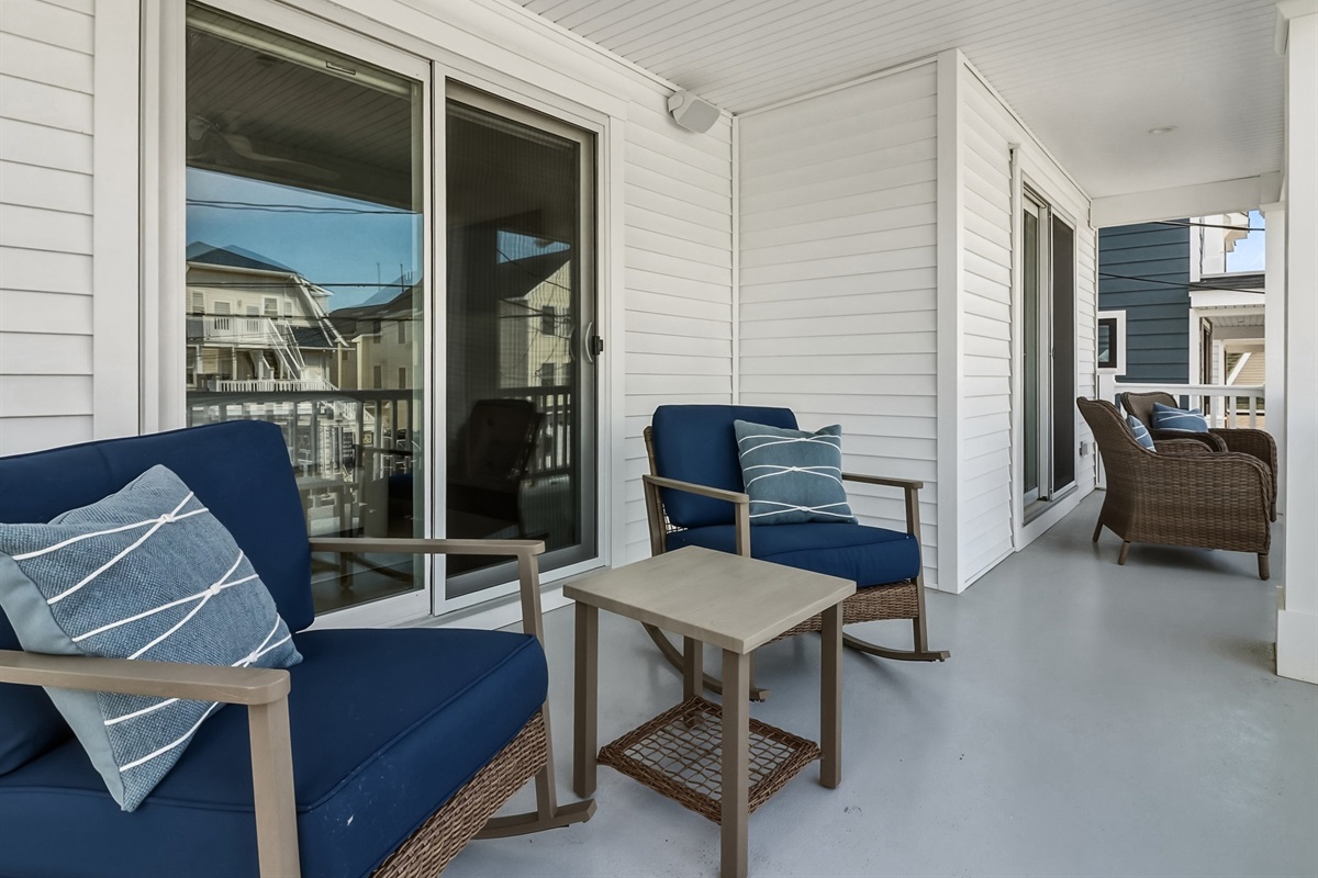 Spacious balcony area with outdoor furniture