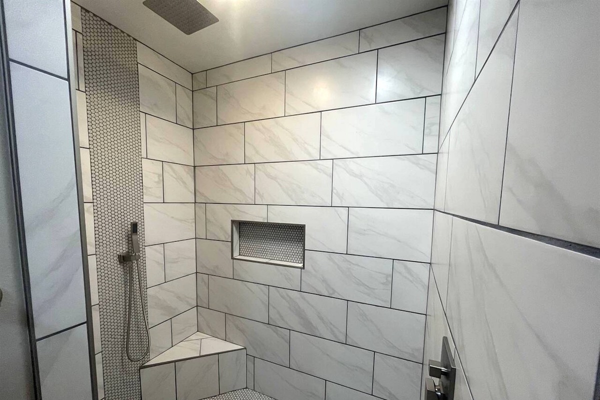 A large walk-in shower is in the primary ensuite bathroom.