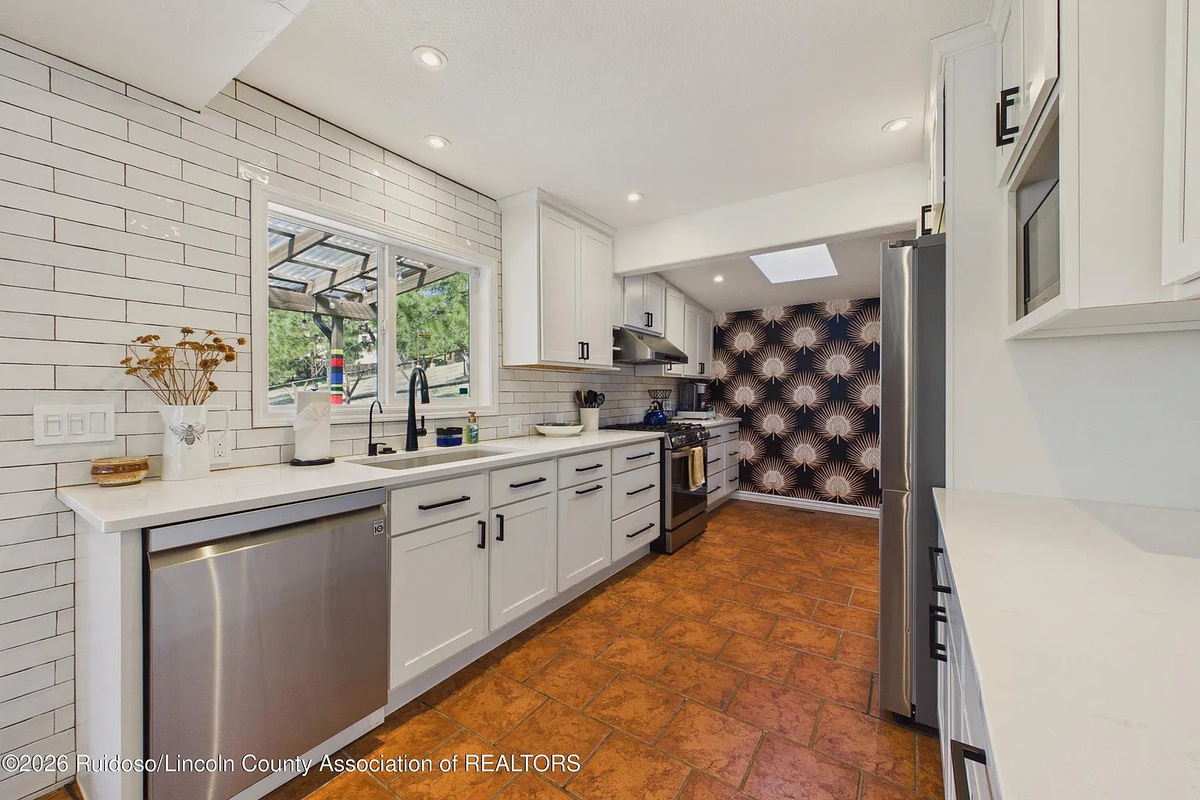 Fully stocked kitchen with gas stove and one touch faucet