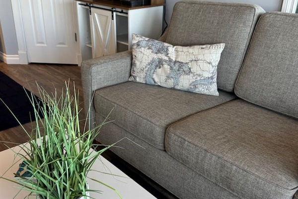 Comfortable couch that pulls out to a sleeper sofa. Wake up to beautiful views of the bay ☀️ 