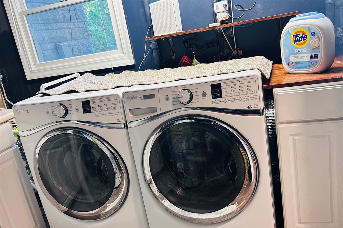 Front load washer and dryer in the basement laundry room