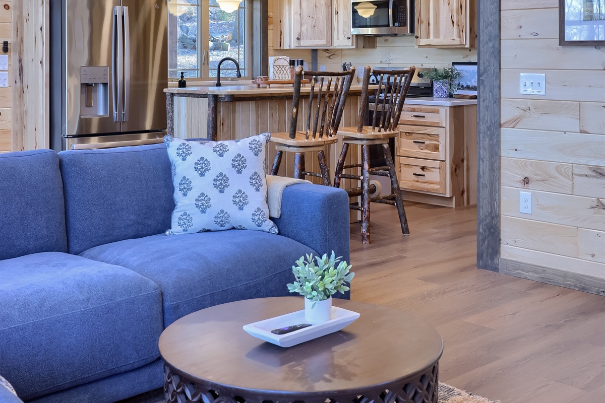 Open concept, with a peak into the kitchen from the living room