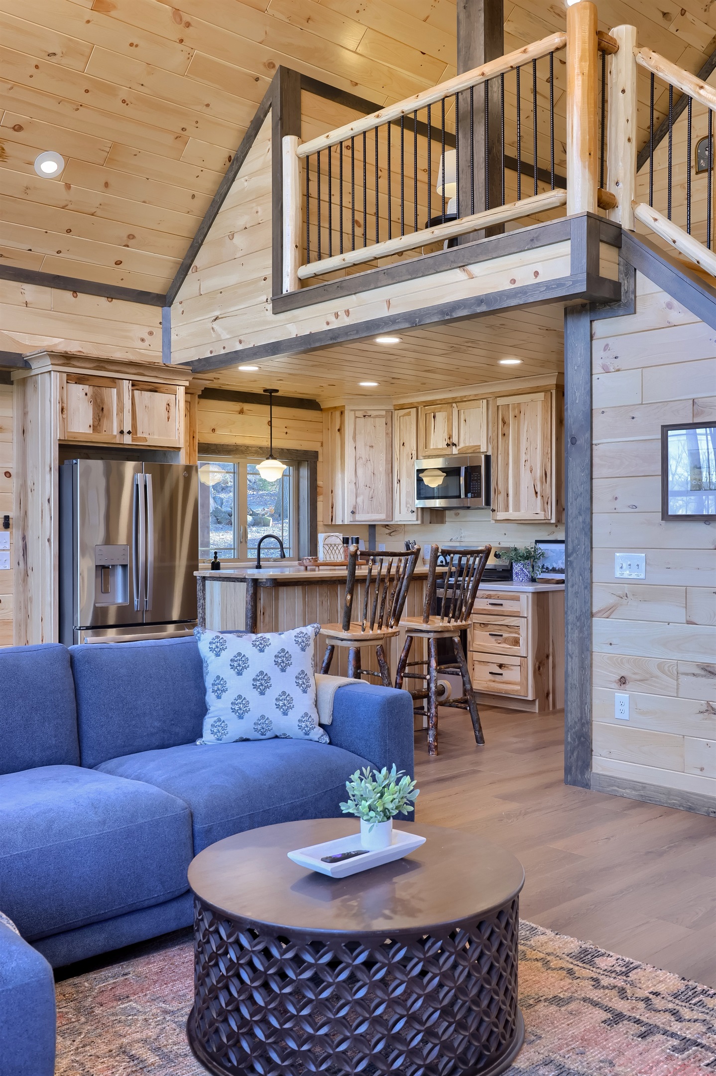 Open concept, with a peak into the kitchen from the living room