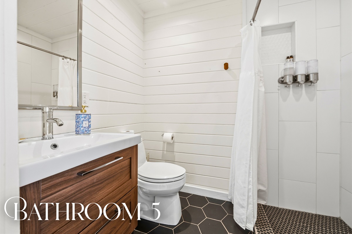 Refresh in the cabin bathroom where modern finishes and a clean, functional layout offer both comfort and convenience.