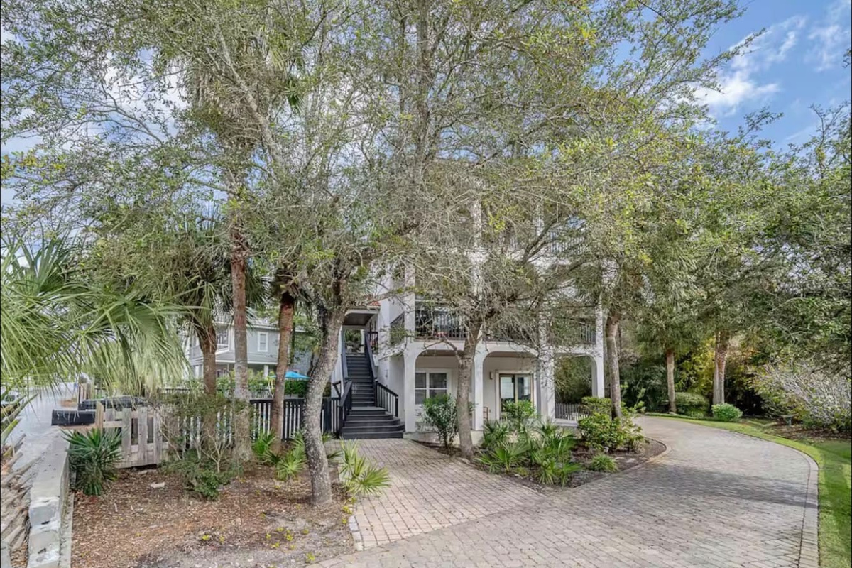 Welcoming exterior view showcasing private parking and the scenic entryway to your 30A vacation home