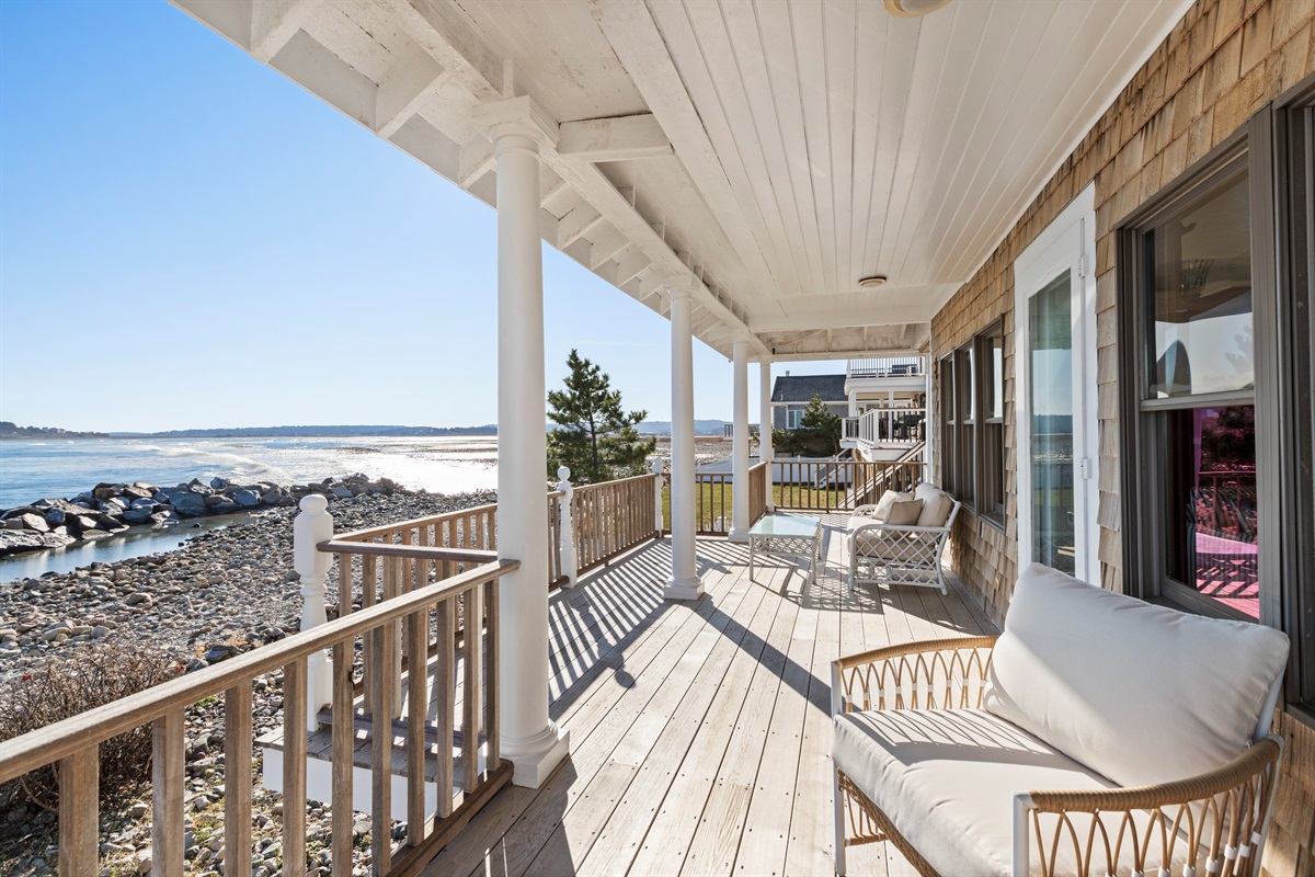 Spacious oceanfront deck with cozy seating, where you can unwind, take in the fresh sea breeze, and enjoy beautiful coastal views just steps from the shore. 🌊