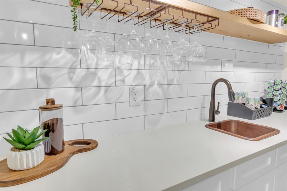 Cheers to a chic and sparkling clean kitchen. Unwind with a glass of wine!