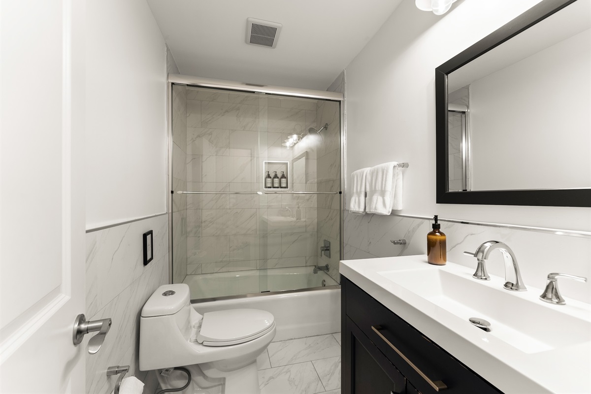 Upstairs bathroom #2 with shower/tub combo.