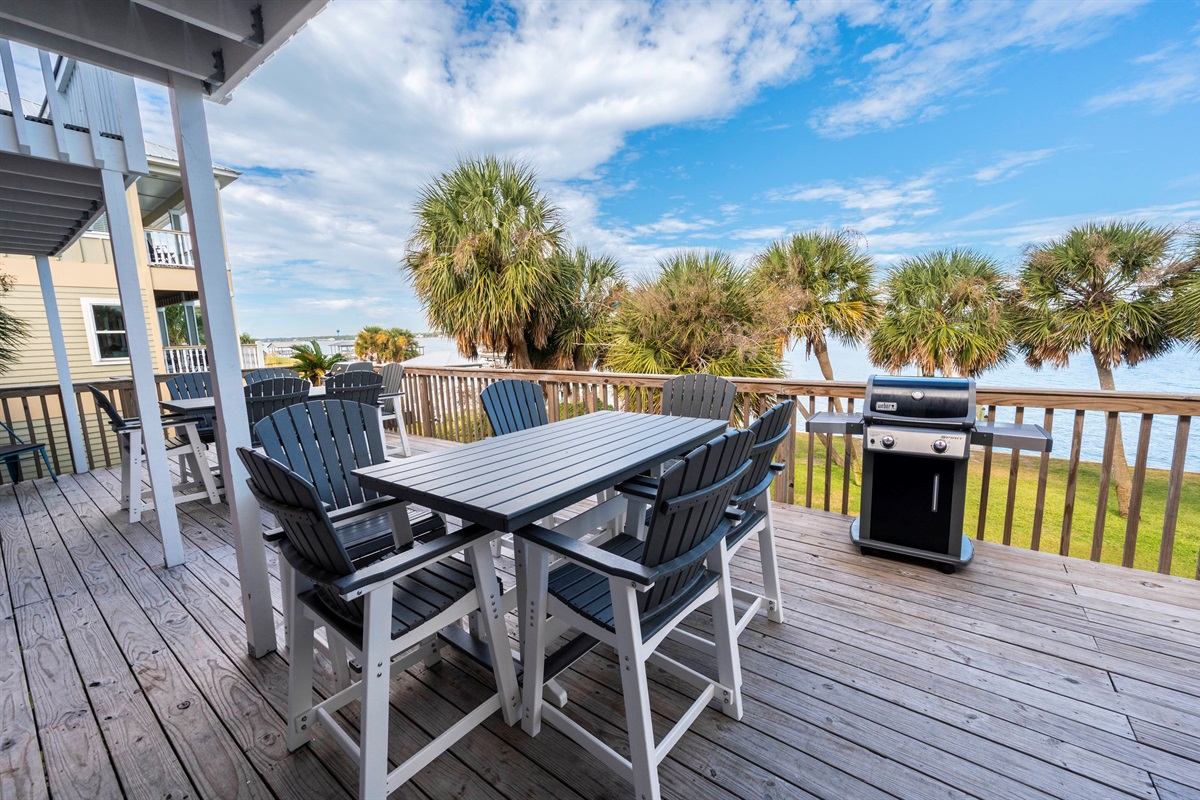 Lakeside paradise: cozy deck perfect for BBQs, gatherings, and serene water views.