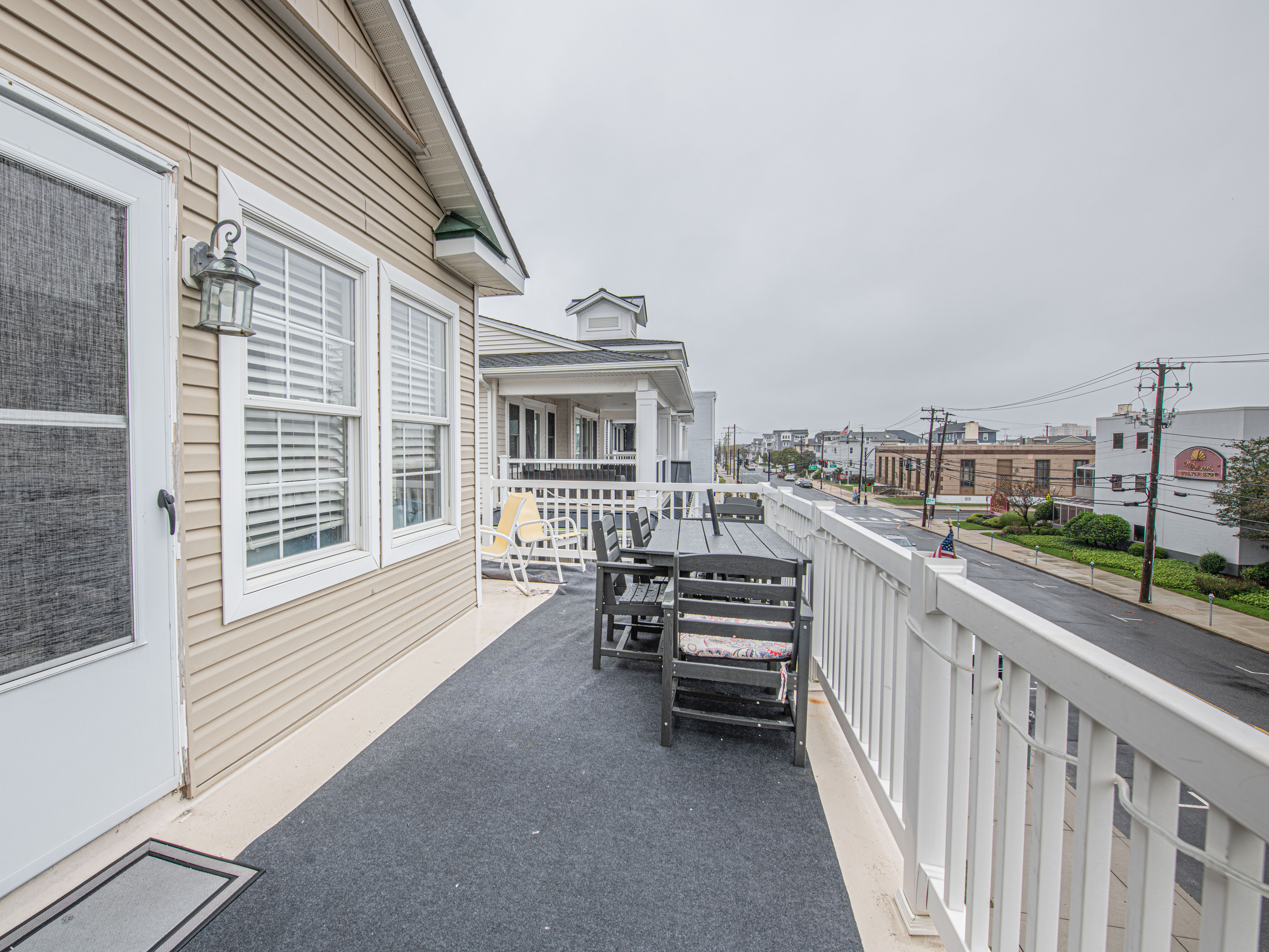 Outdoor Balcony with Dining Table and Street View