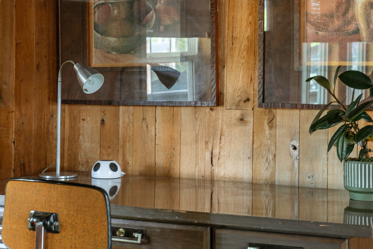 The desk is thoughtfully equipped with a lamp and charging station, giving you a bright, convenient space to work or stay connected during your stay.