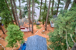 Aerial view of the property with lake in the background