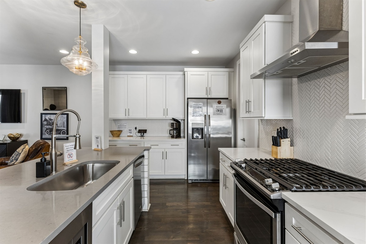 Cook for the whole group without feeling cramped &mdash; island with sink, full-size appliances, and enough counter space to actually prep a real meal.