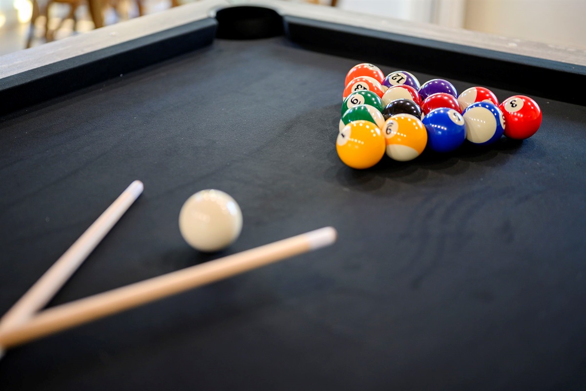 Pool table ready for friendly competition and late-night games.
