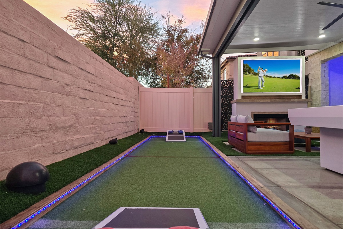 Outdoor games including corn hole and bocce ball.