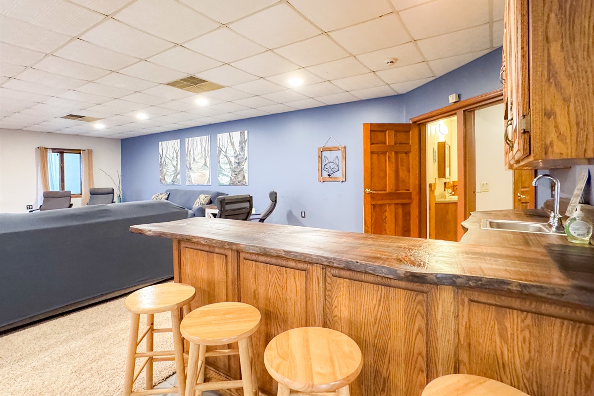 bar top between the downstairs kitchen and living room