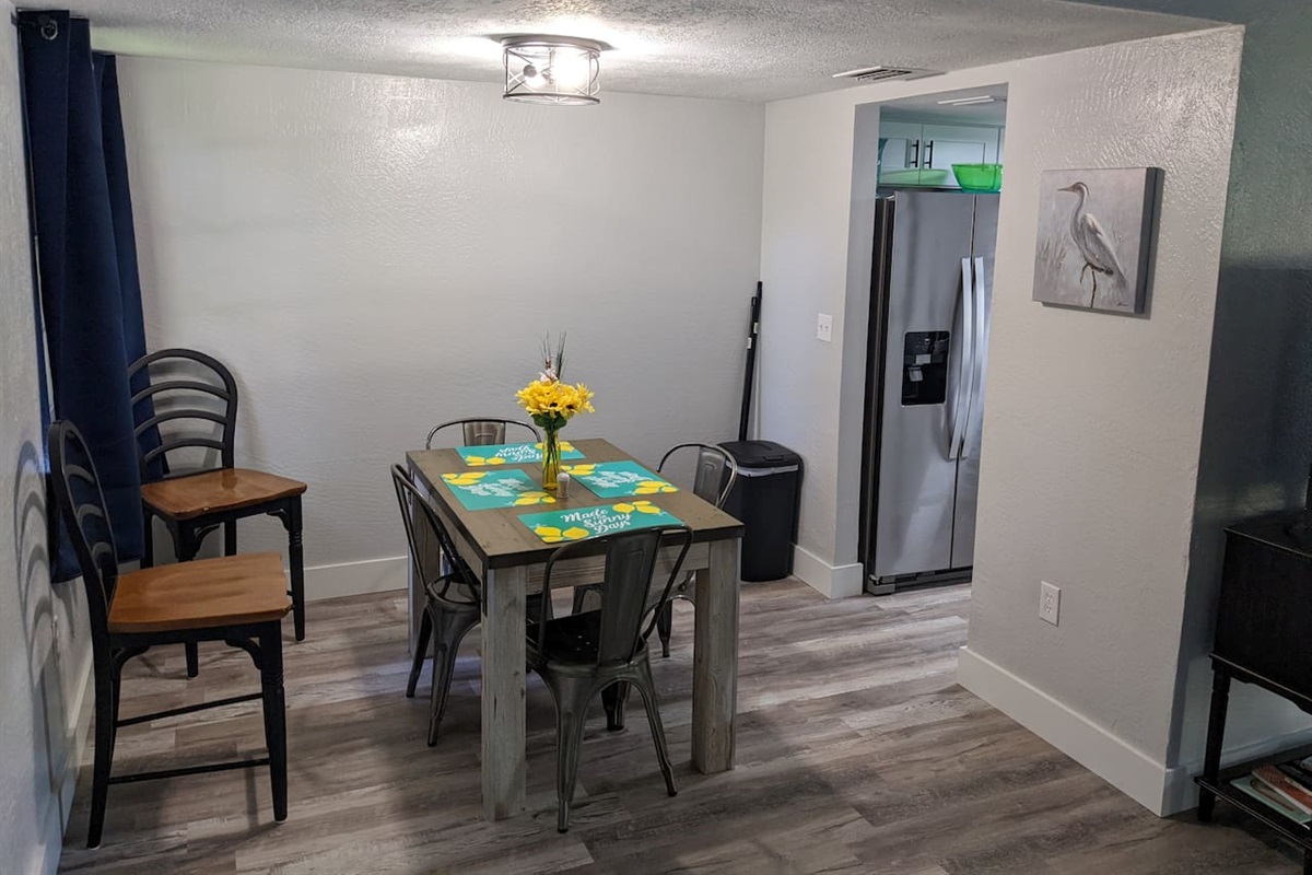 4-setting dining room table with extra chairs