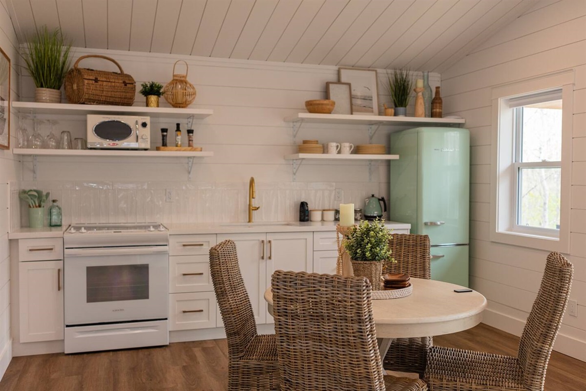 Full Kitchen that includes stove, fridge, microwave and toaster. 