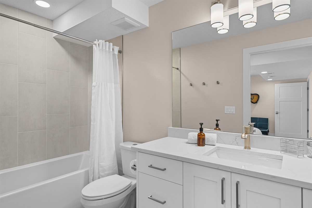 Bright ensuite bathroom with clean, modern design.