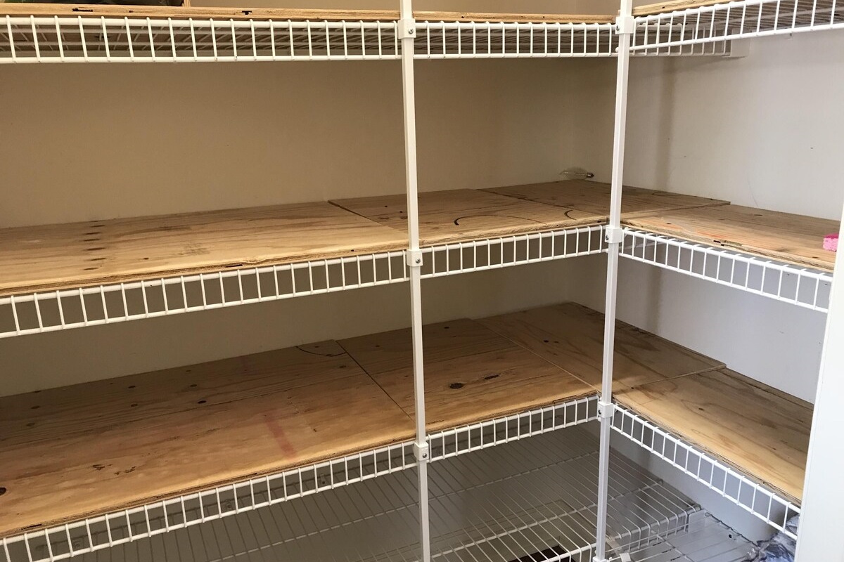 pantry w/ lots of shelving and room for all your food storage 