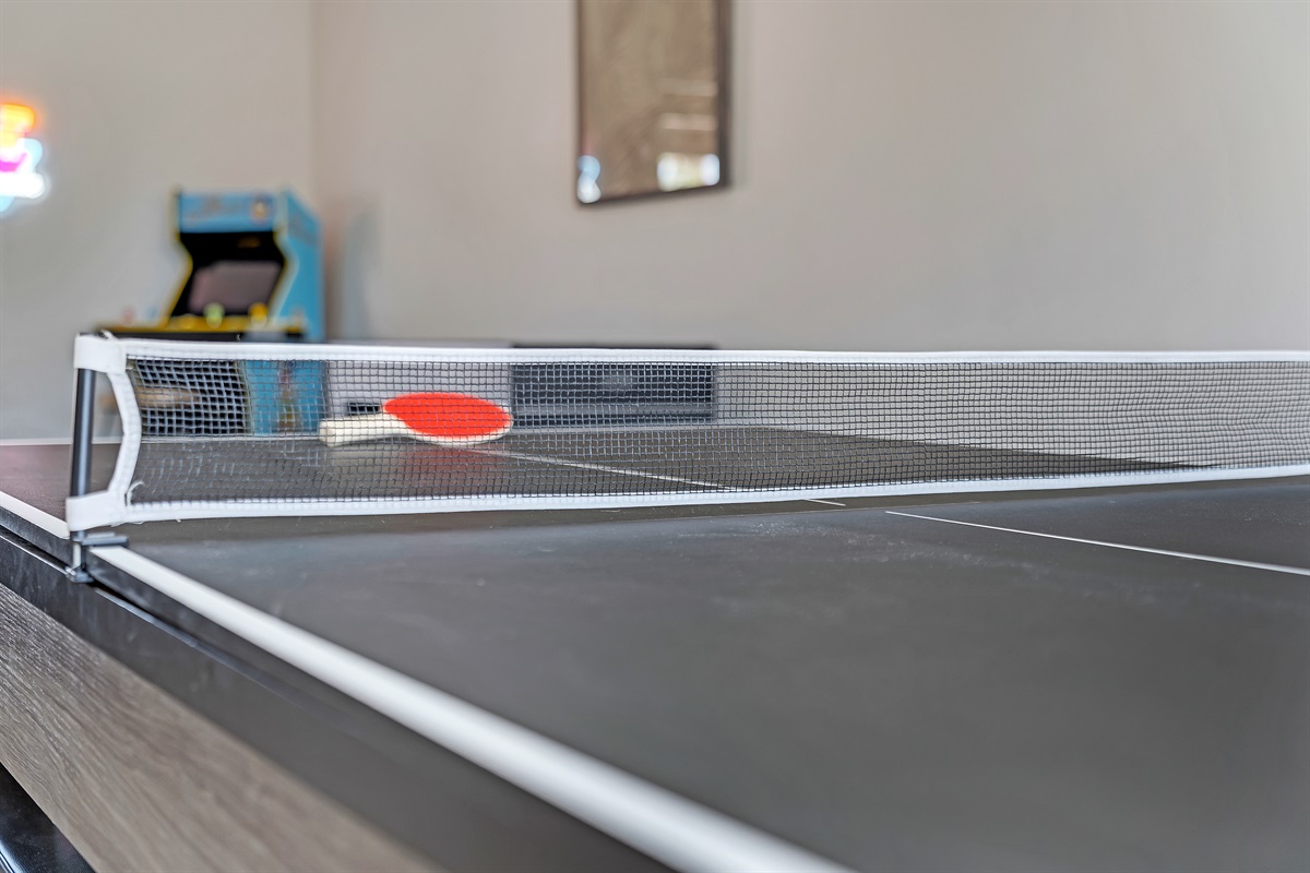 Dining room with large dining table that converts to pool table and ping pong table