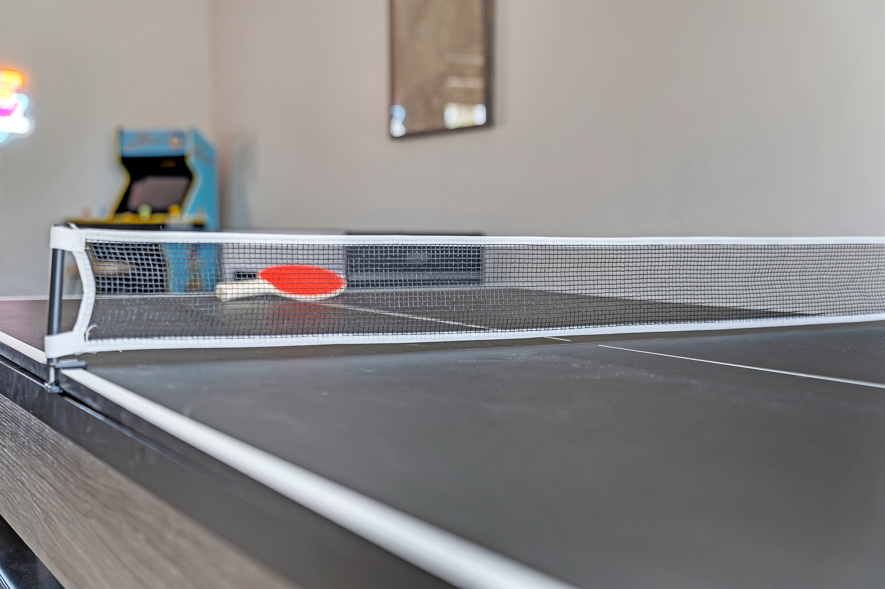 Dining room with large dining table that converts to pool table and ping pong table