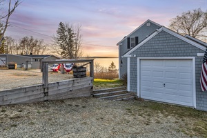 Backside of the house with garage door