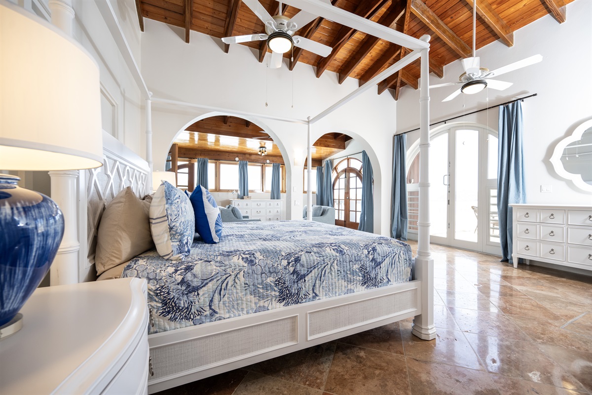 Main Floor Primary Bedroom: two sets of double doors lead out to the hot tub terrace