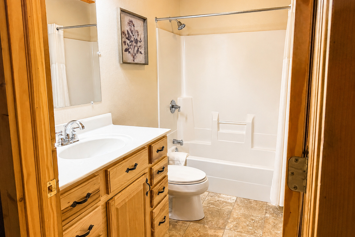 Basement full bathroom with a tub and shower makes mornings and evenings easier when the House is full.
