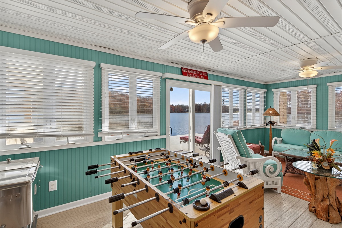 Inside the boathouse is a fun game zone featuring foosball and ample space to unwind, all just steps from the water.