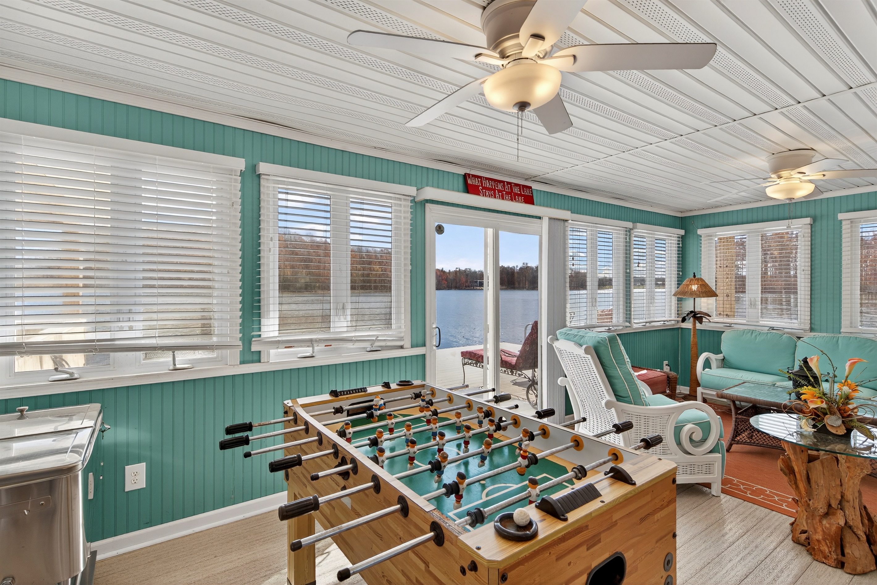 Inside the boathouse is a fun game zone featuring foosball and ample space to unwind, all just steps from the water.