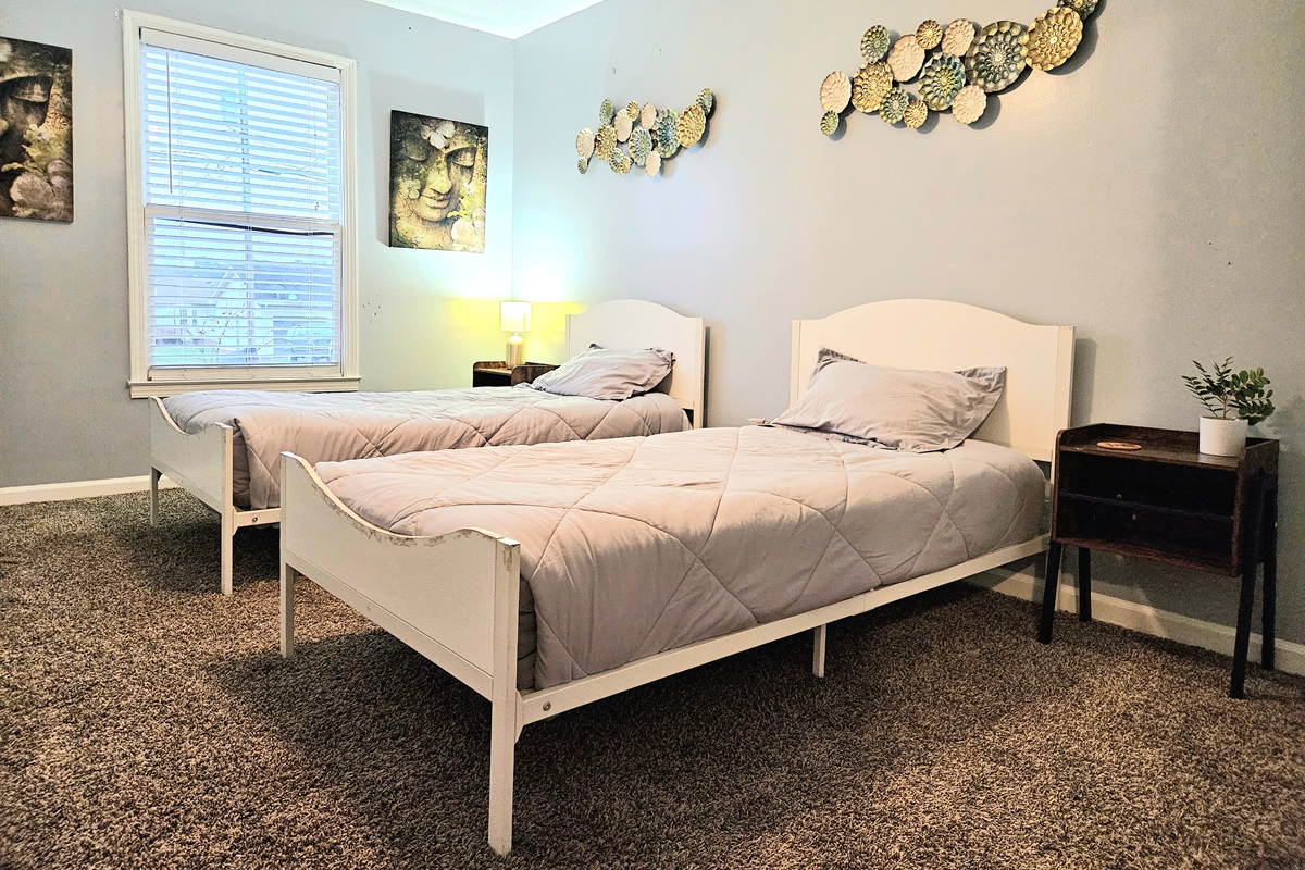Offering versatility and design, this spacious guest room bring flexibility with two identical twin side beds, matching night stands and plenty of storage. Unique decor and natural light make this room a family friendly option.
