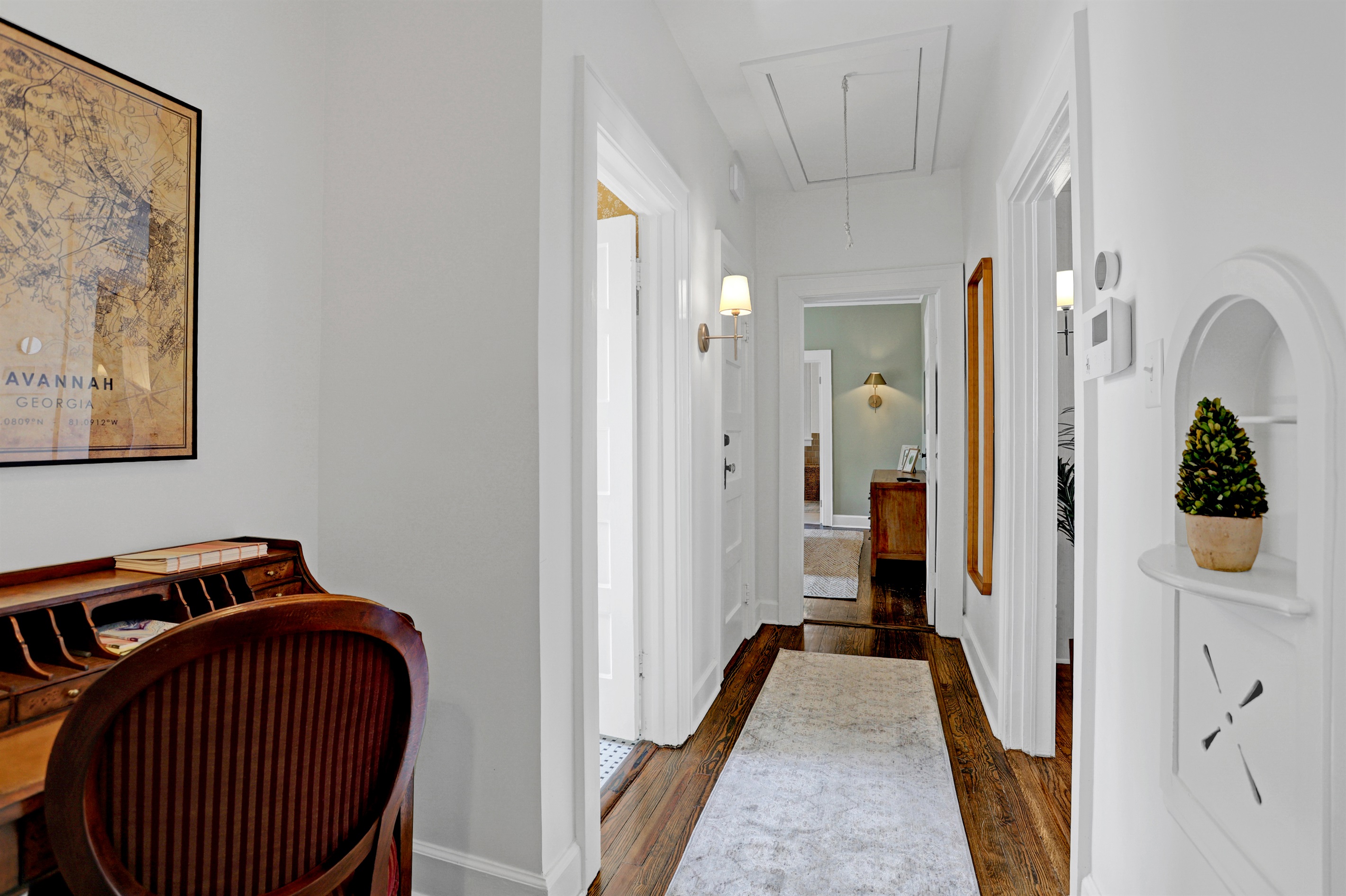 The welcoming hallway connects every room with ease, blending function and style in this charming bungalow.