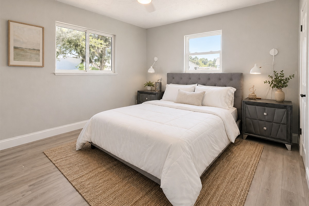 Spacious guest bedroom with comfortable furnishings, ample closet space, and cozy atmosphere for family members or visitors