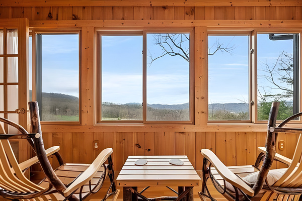 Your front-row seat to the mountains. Unwind in comfort with panoramic window views of the beautiful ridge lines. The perfect cozy indoor nook to slow down, unplug, and enjoy the scenery.