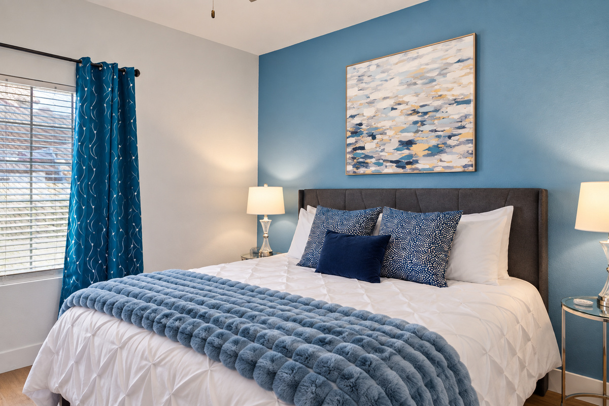 “Modern bedroom with designer touches and curated decor.”
