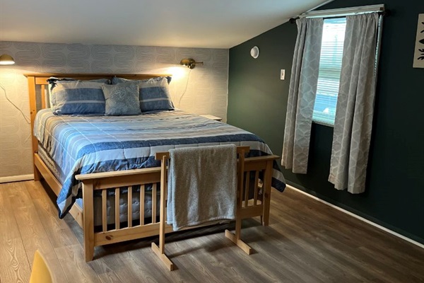 Loft bedroom with a queen bed