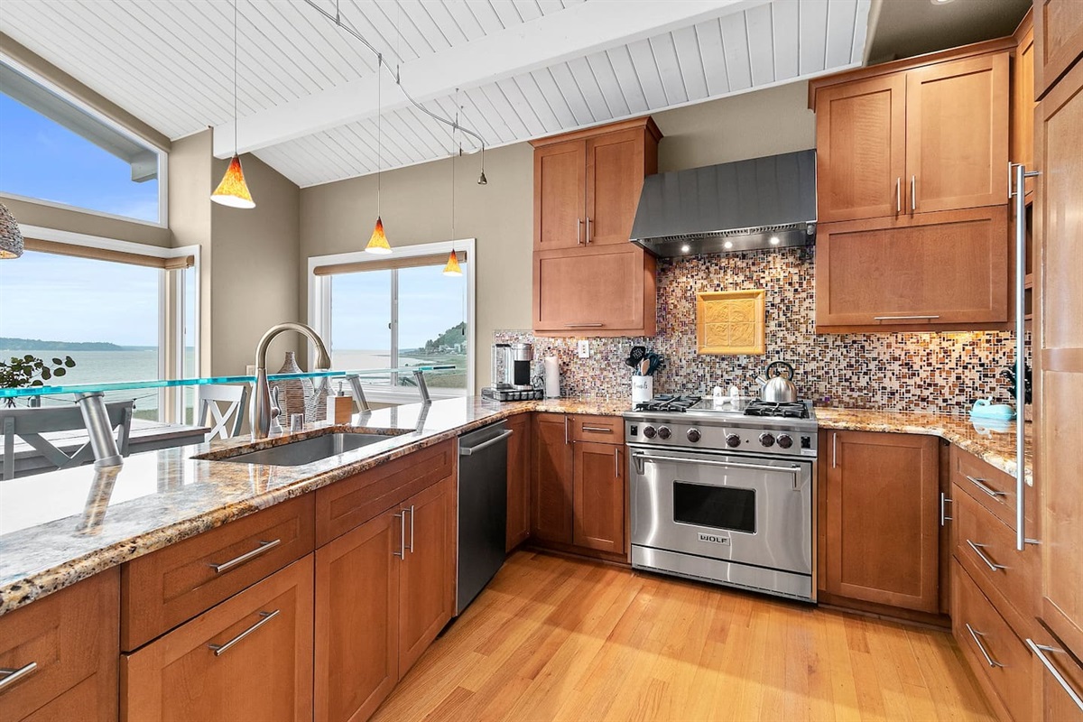 WOLF gas stove and open plan kitchen.