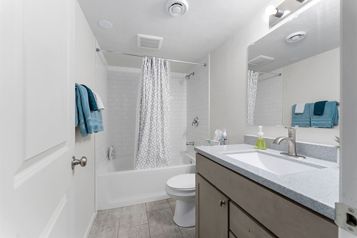 Lower level bathroom with tiled tub/shower! 