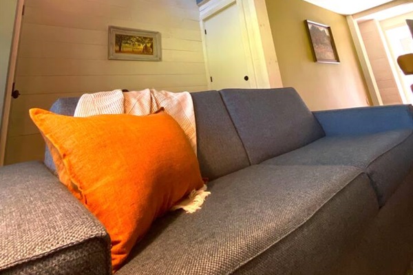 Architectural second floor opening lets in a warm interplay of light.