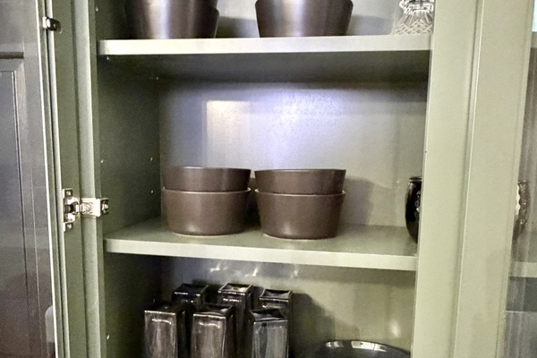 Fully equipped kitchen with pots and pans, utensils, dishes, and stemwaer