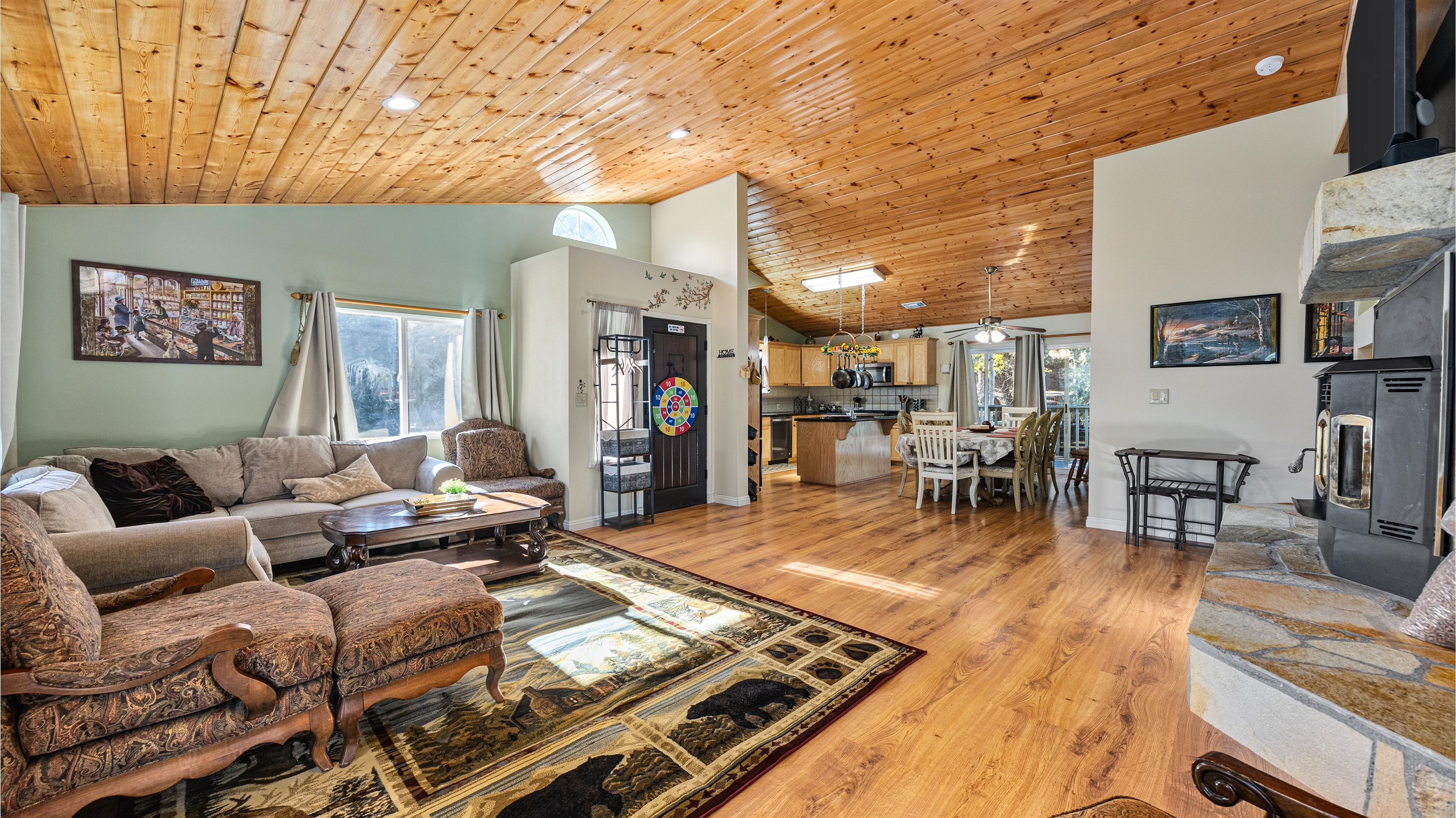 Large windows flood the living room with natural light and frame truly breathtaking views.