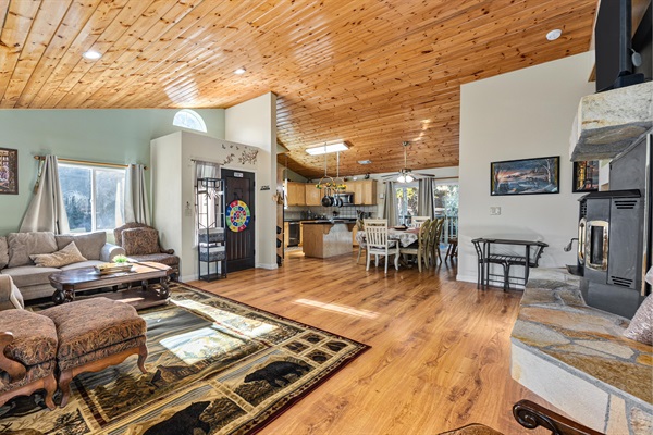 Large windows flood the living room with natural light and frame truly breathtaking views.
