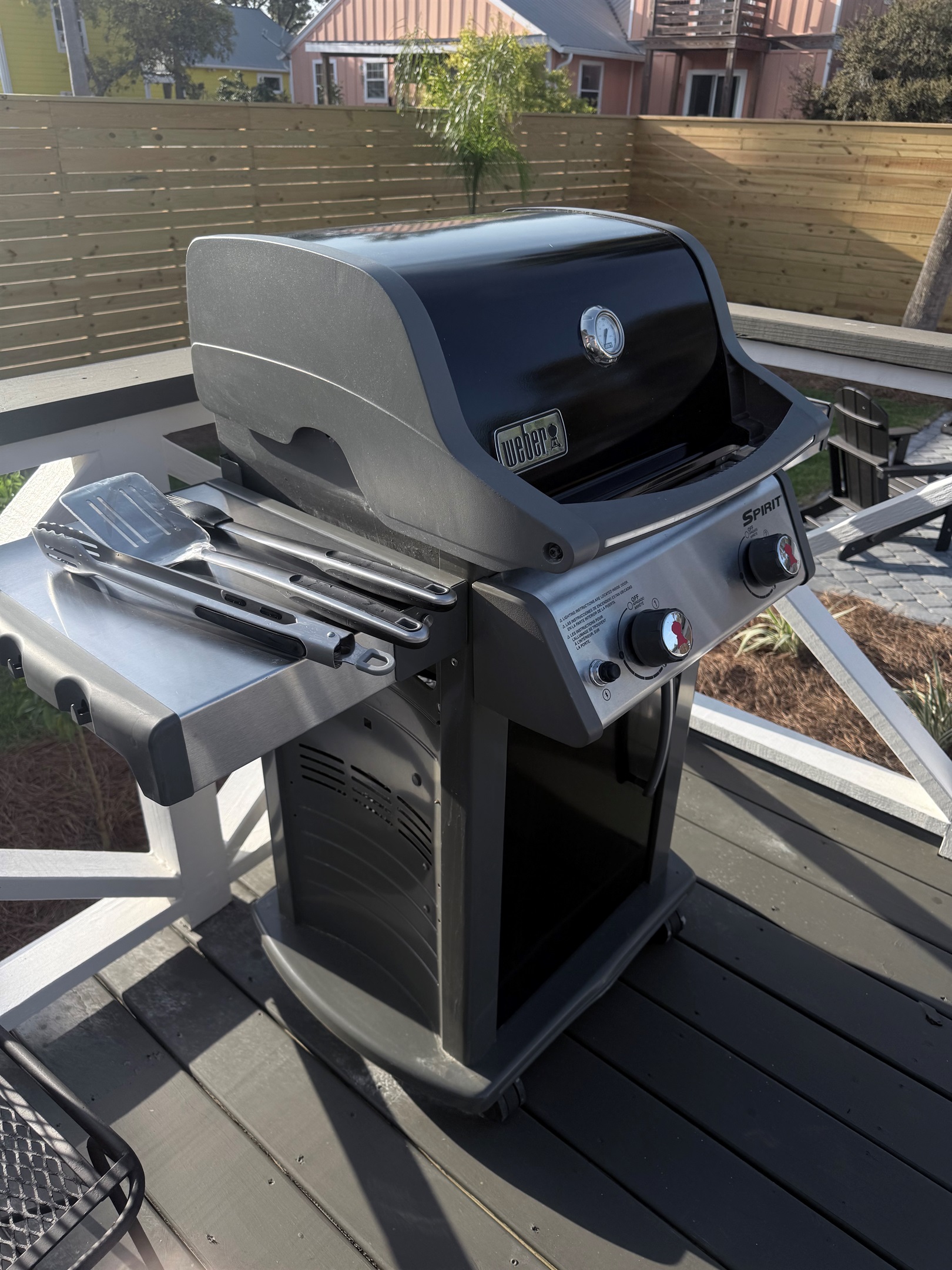 Gas grill with grilling utensils