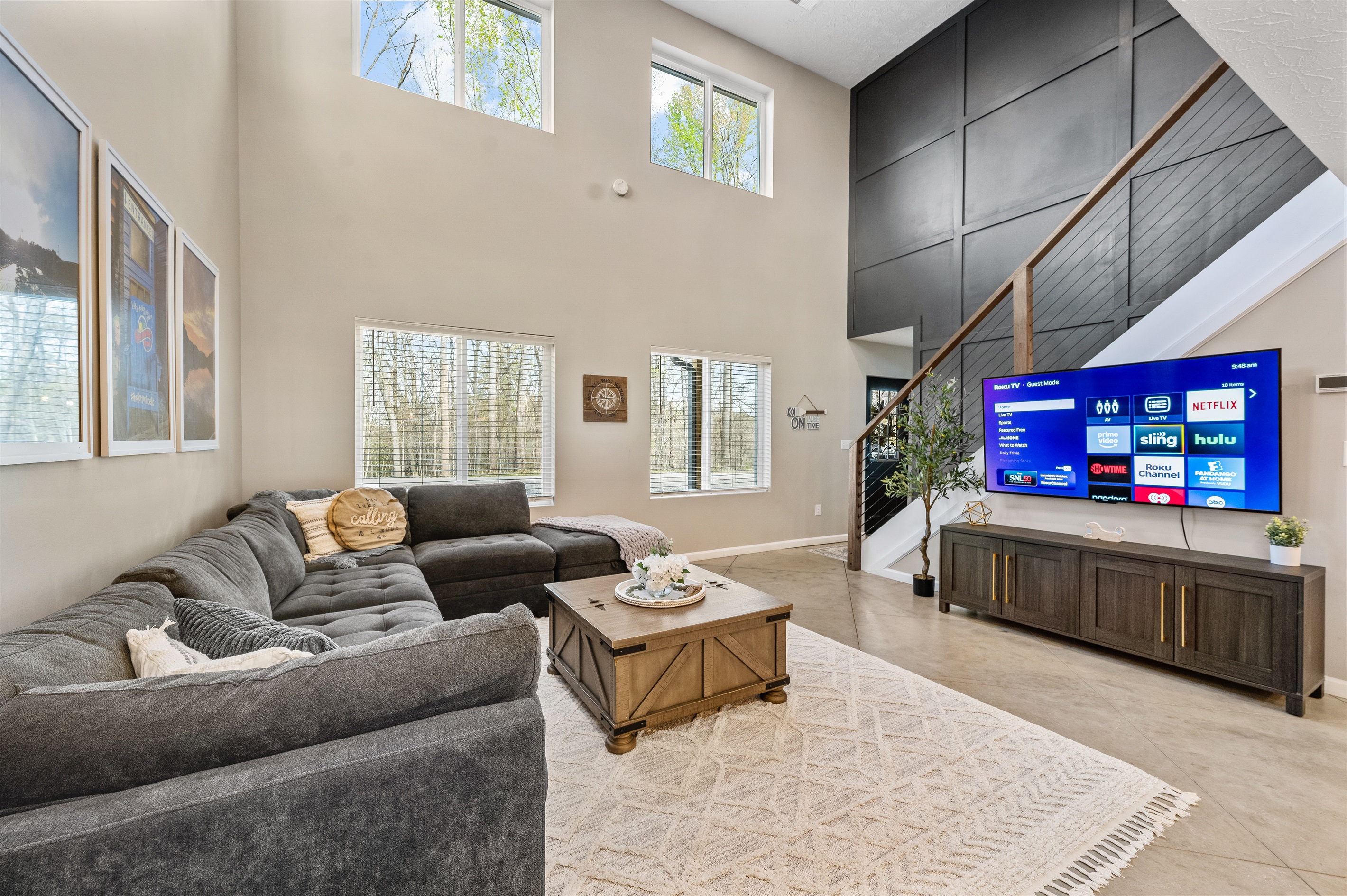 A cozy accent wall adds warmth and character to this inviting entertainment space.