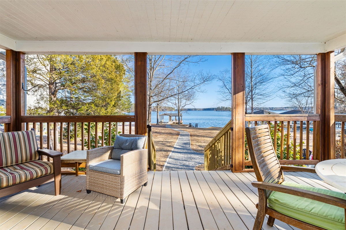 Veranda: Sip your coffee while soaking in stunning lake views from this charming porch!